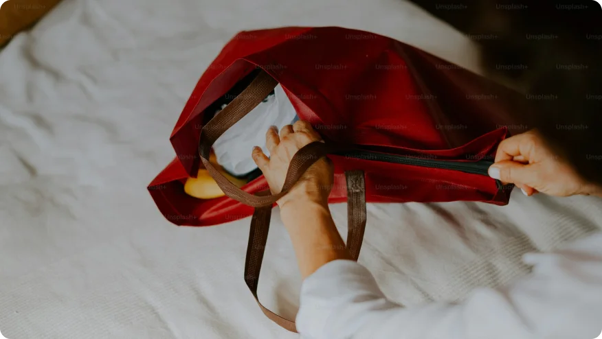a person wearing a red garment and black heels