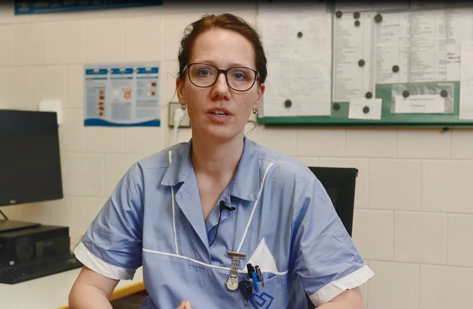 a man wearing a blue shirt